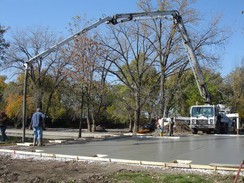 A concrete pump truck pouring a large slab for Central Illinois Construction Services Inc. in Effingham, IL
