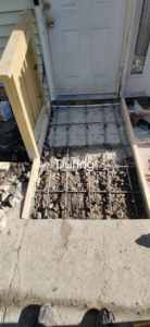 During construction of a concrete ramp, showing rebar and forms, by Bernardo Buildings Inc in Virginia Beach, VA.