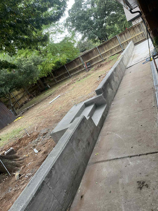 A concrete retaining wall with integrated steps under construction by Power concrete in Thousand Oaks, CA.