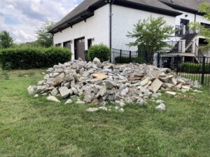 A large pile of concrete and demolition rubble awaiting removal by The Removal Squad LLC in Orlando, FL.