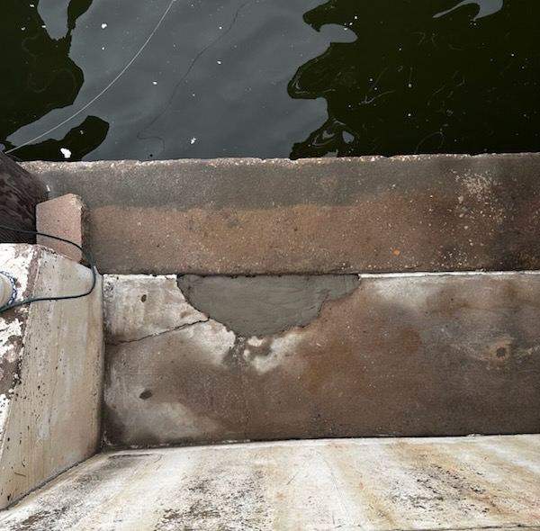 A freshly patched concrete seawall repair by Complete Foundation Repairs in Corpus Christi, TX.