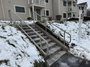 Newly installed concrete stairs with sturdy metal railings by Lee Fence and Outdoor in York, PA.