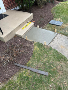 Concrete step repair in progress with wet concrete and formwork by DG Maintenance Services LLC in Wilmington, DE