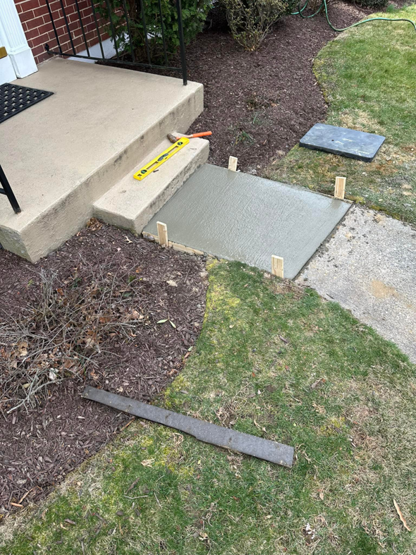 Concrete step repair in progress with wet concrete and formwork by DG Maintenance Services LLC in Wilmington, DE
