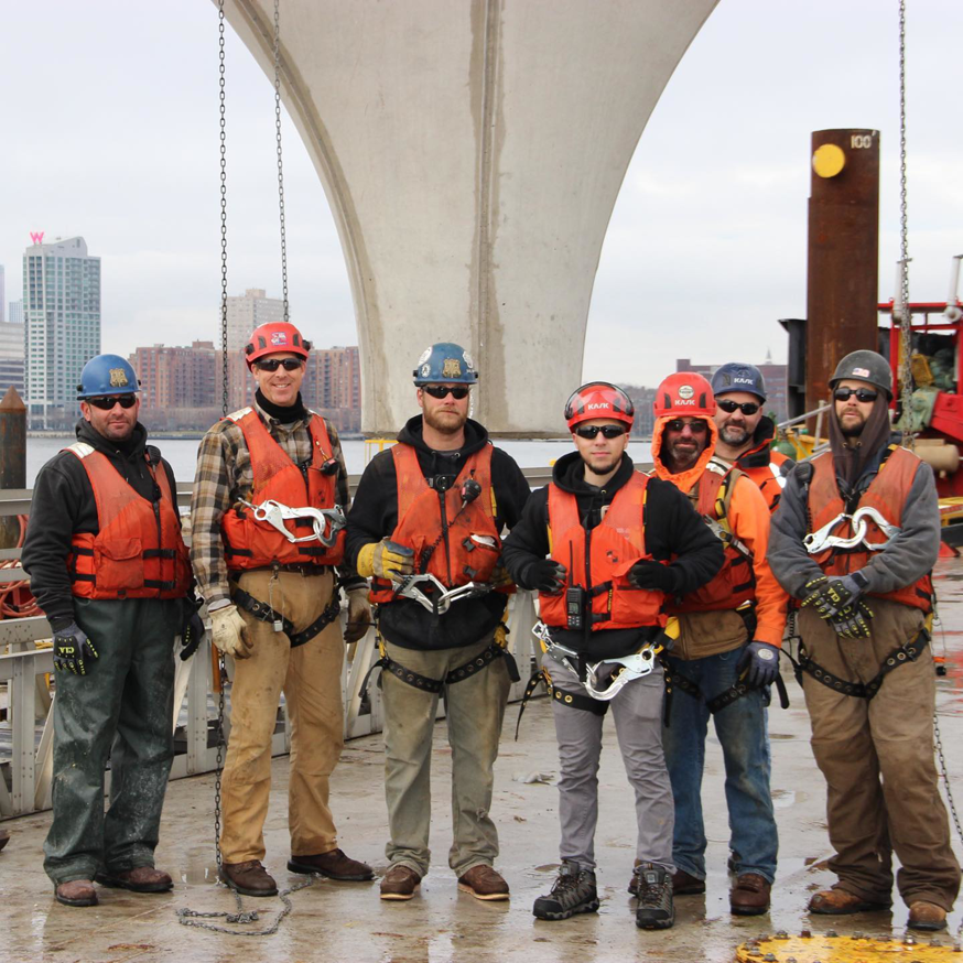 A construction crew in safety gear on a marine job site for Weeks Marine, Inc. in Cranford, NJ