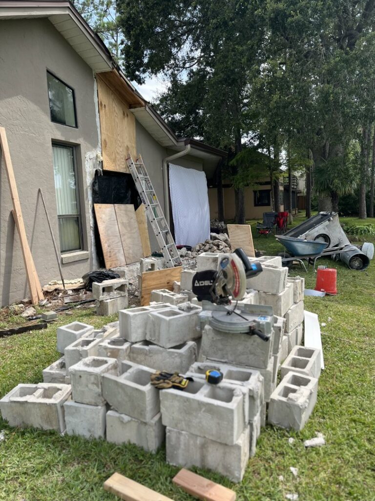 Construction debris and materials at a house renovation site, ready for junk removal by DUMP 4 U Hauling in Jacksonville, FL.