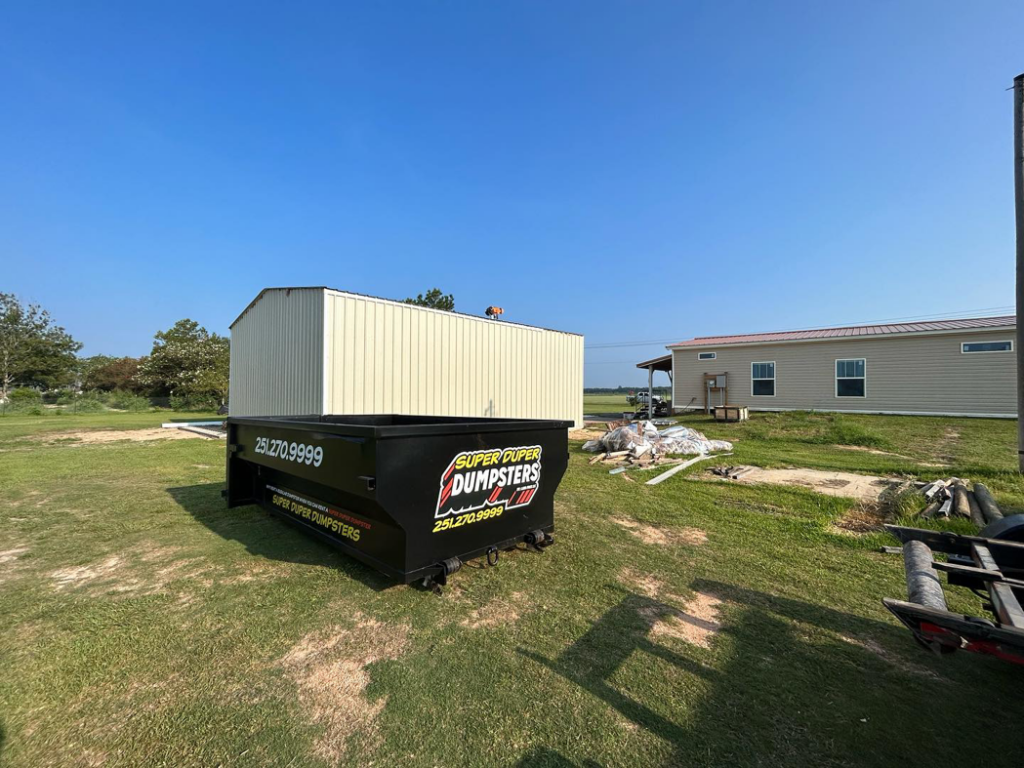 A Super Duper Dumpsters roll-off container on site for construction debris removal in Mobile, AL.