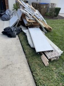 A large pile of construction and renovation debris ready for removal by The Removal Squad LLC in Orlando, FL.