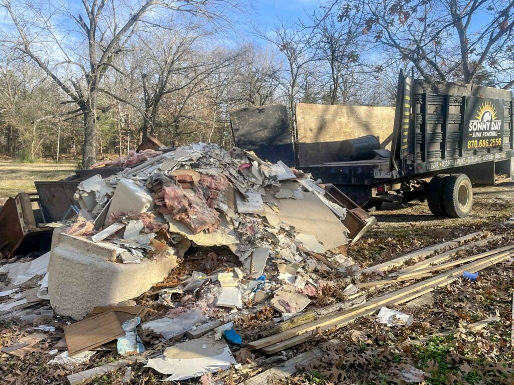 A large pile of construction debris awaiting removal by Sonny Day Junk Removal in Batesville, AR.