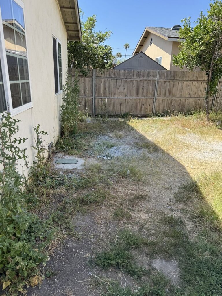 A pile of construction debris, cardboard, and plastic sheeting for removal by Elite Hauling & Junk Removal in San Diego, CA.
