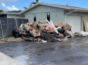 A large pile of construction debris and household junk ready for removal by Gator Junk Removal in Miami, FL.
