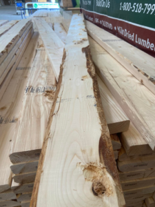 A large stack of construction lumber and building materials for projects by Handy Hubby South Elgin, IL