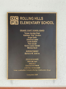 A dedication plaque for Rolling Hills Elementary School, naming Bishop Construction Group, Inc. as Construction Manager in Orlando, FL.