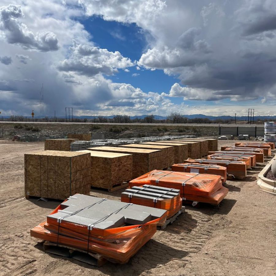 Various construction materials, including wrapped concrete products, stored at Arco Concrete Inc in Fort Lupton, CO