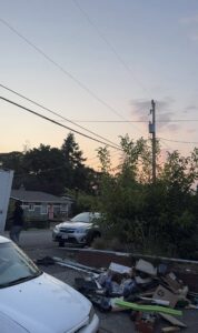 A large pile of construction debris, including wood, cardboard, and pallets, at a building site, ready for cleanout by JUNK IN THEE TRUNK in Kent, WA.