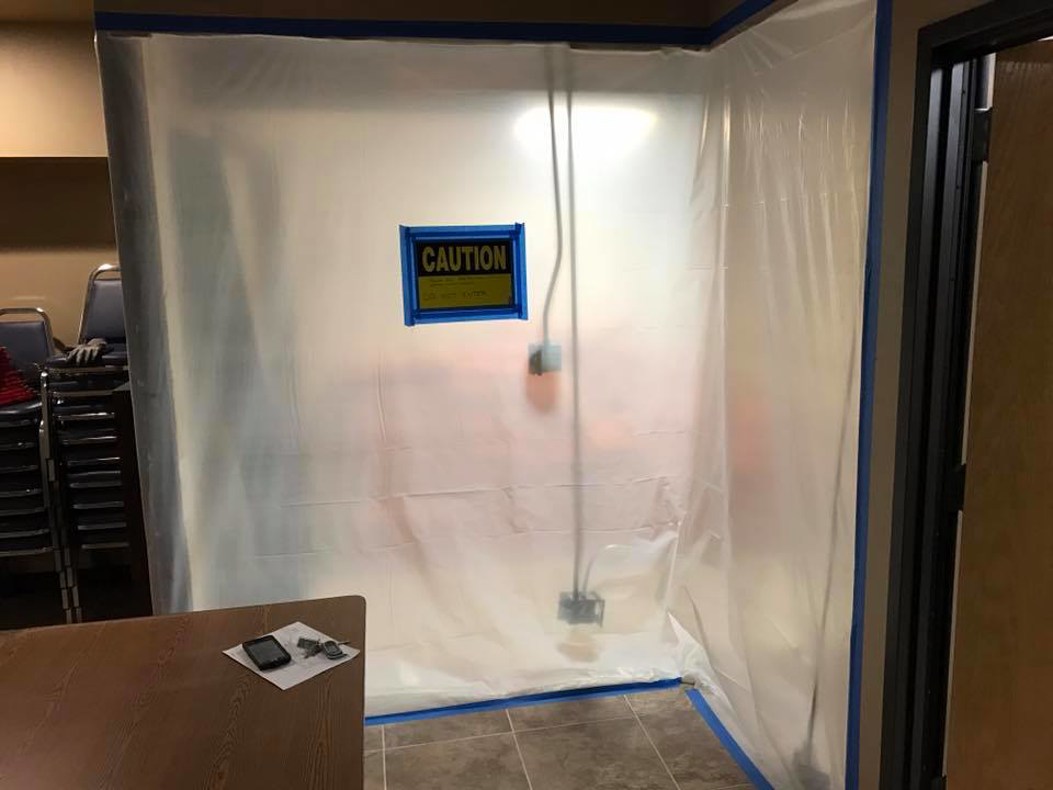 A temporary safety enclosure with a caution sign at a Whitehorn Construction job site in Austin, TX.