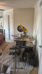 Construction tools and drop cloths set up for a bedroom renovation by MLJ Construction and Design in Pittsburgh, PA