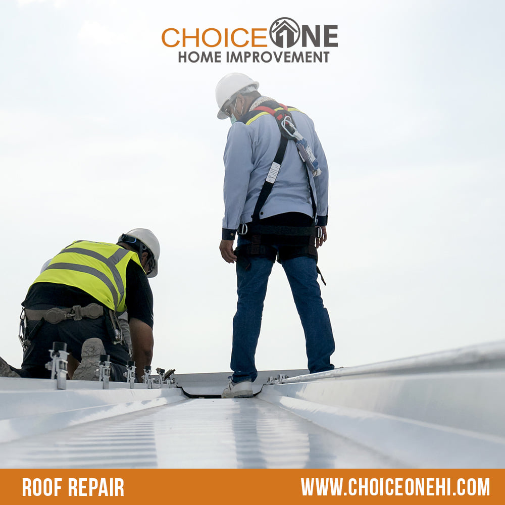 Construction workers performing roof repair on a metal roof for Choice One in Miami, FL