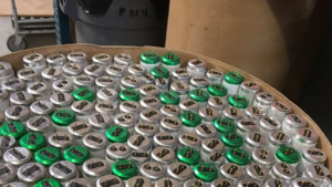 A container filled with fluorescent lamp ends for recycling by Quick Light Recycling in South San Francisco, CA.