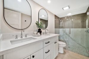 A contemporary bathroom with a double vanity and glass-enclosed shower by AZ New Bath in Glendale, AZ