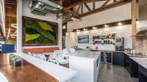 A contemporary kitchen design with white cabinets and a large island, expertly crafted by ETI Construction in Chicago, IL.