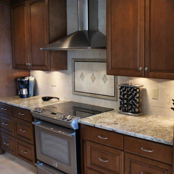 A contemporary kitchen remodel featuring stainless steel appliances and granite countertops by City Home Improvement Inc in Portland, OR.