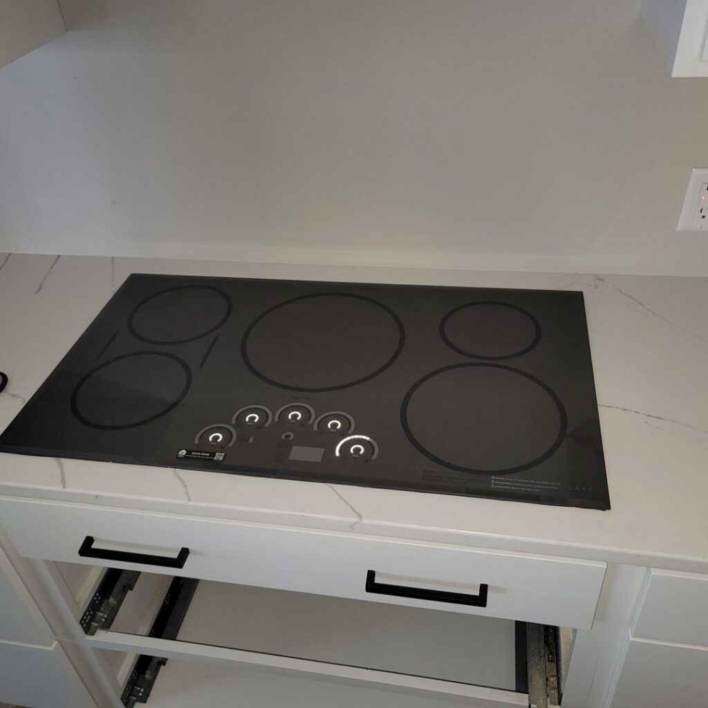 A new electric cooktop professionally installed into a kitchen countertop by Amazing Handyman Services in West Fargo, ND