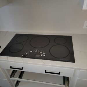 A new electric cooktop professionally installed into a kitchen countertop by Amazing Handyman Services in West Fargo, ND