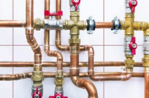 Copper plumbing pipes and valves, showcasing installation or repair by Epic Electric, Heating, Cooling & Plumbing in Spokane, WA