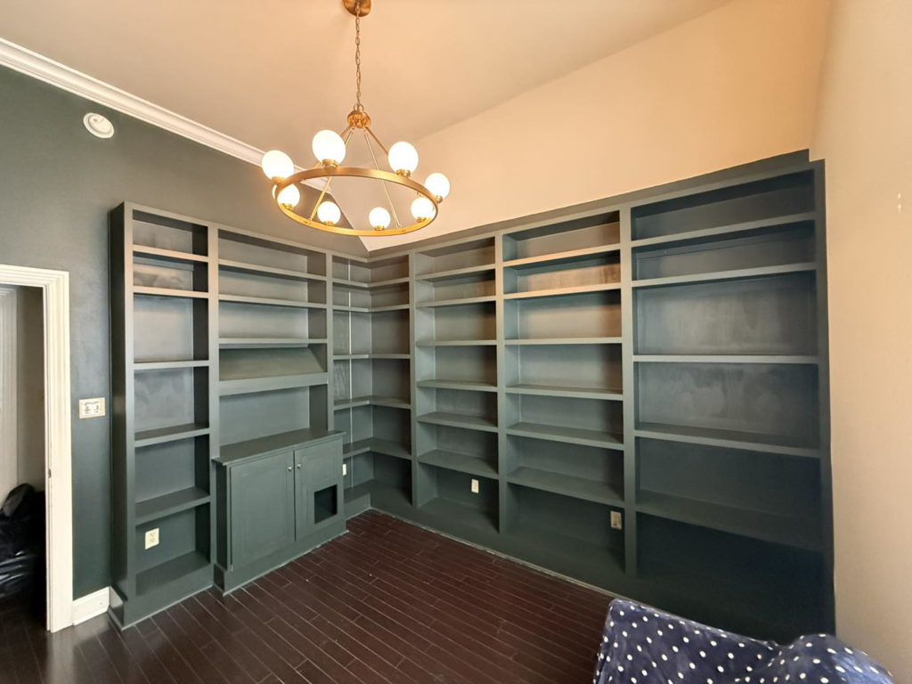 Corner built-in bookshelves with a custom cabinet, installed by Profix Home Repair in Jonesboro, AR.