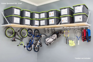 Corner garage shelving unit with storage bins and hanging sports equipment installed by Bend Garage Storage Solutions in Bend, OR