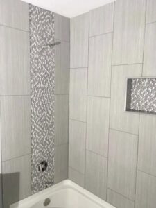 A bathroom featuring a corner tub and decorative tile installation by Myers & Myers Construction in Spokane, WA.