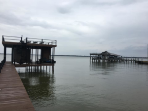 Two boat docks and piers, one with a covered area, constructed by TYCO Roofing & Construction LLC in Allen, TX.