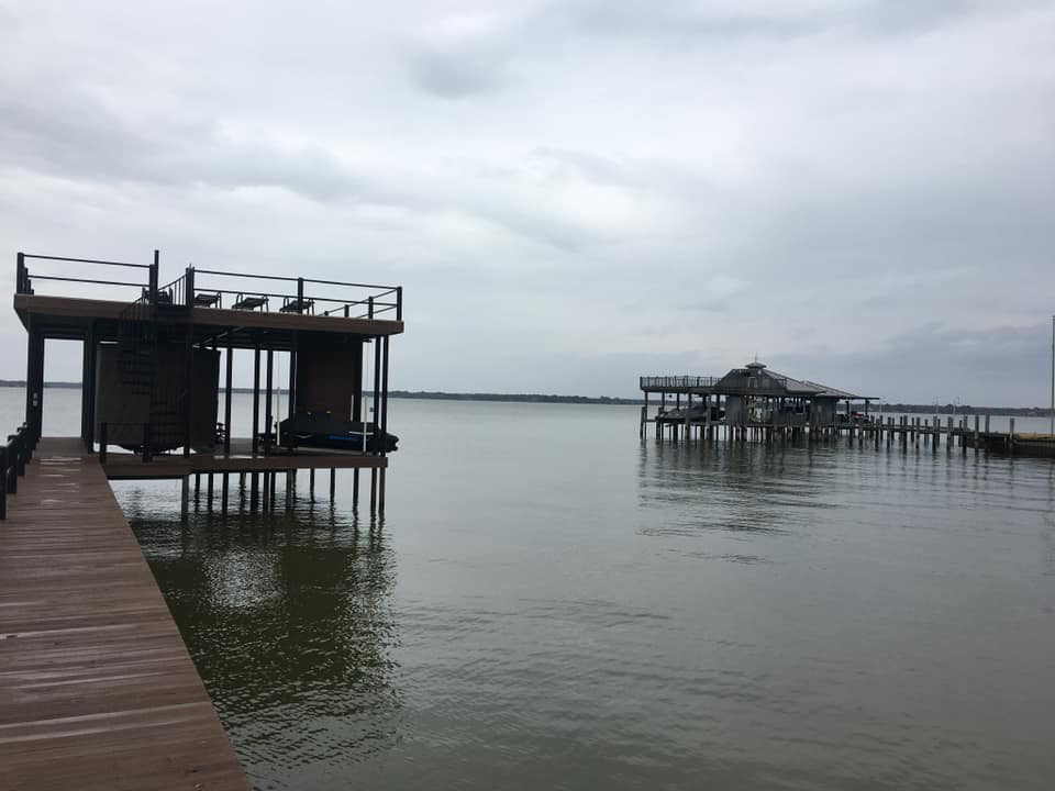 Two boat docks and piers, one with a covered area, constructed by TYCO Roofing & Construction LLC in Allen, TX.