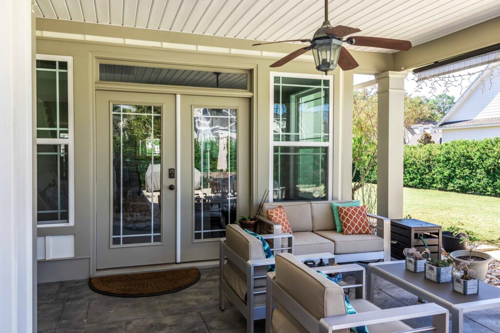 Covered patio with ceiling fan installation by American Home Improvements, LLC in Knoxville, TN
