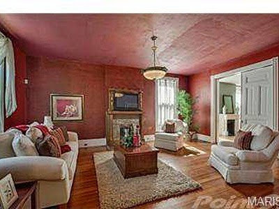 A cozy living room featuring a fireplace and comfortable seating, showcasing interior remodeling by Major League Handyman and Remodeling in St. Louis, MO.