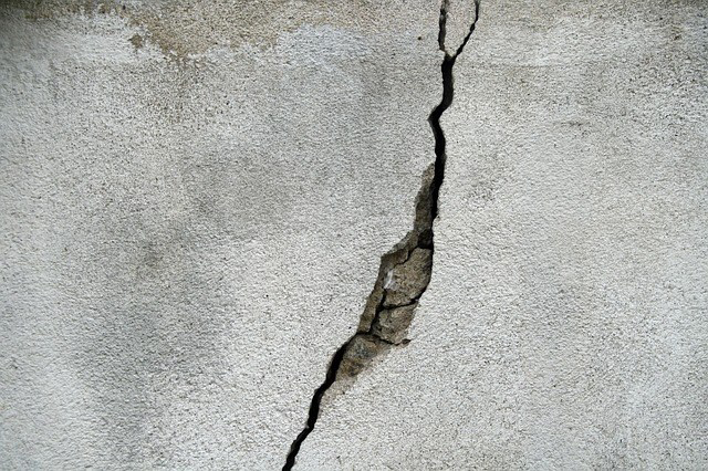 A large crack in a concrete wall, indicating a need for repair services from Abbot Building Restoration Co., Inc. in Boston, MA