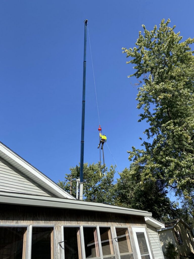 Capital Tree Company performing crane-assisted tree removal or trimming services in Des Moines, IA.