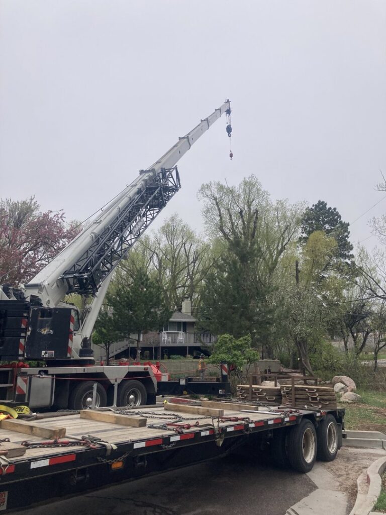 A large crane used for tree removal and heavy lifting by Tall Timbers Tree & Shrub Service in Colorado Springs, CO.
