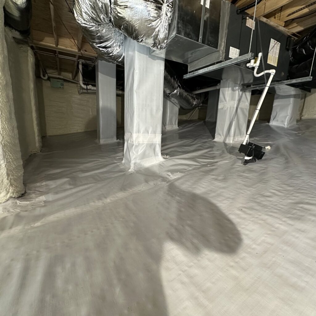 A clean crawl space with vapor barrier and insulation installed by Koala Insulation of Charlotte, NC