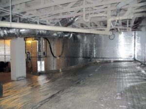 A sealed crawl space with a vapor barrier and insulation installed by Indoor Environmental Systems in Cary, NC.