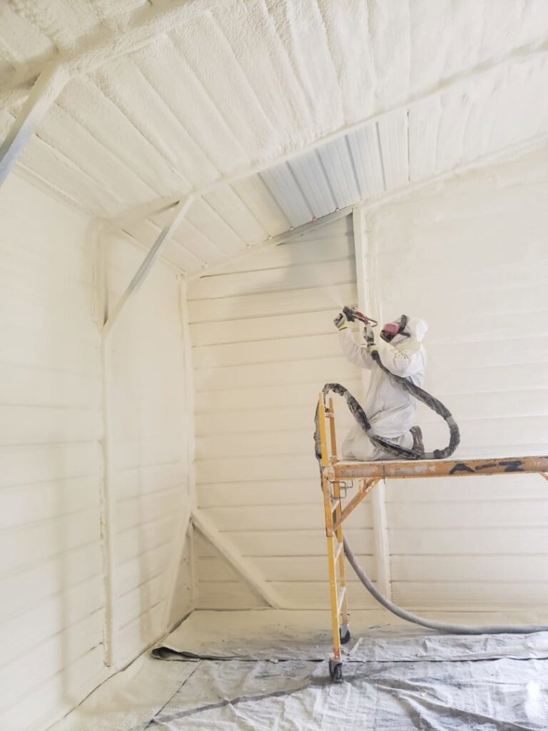 Spray foam insulation applied to the underside of a floor in a crawl space by Absolute Pro Insulation in Corpus Christi, TX.