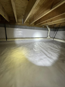 An encapsulated crawlspace with insulated ducts and a wrapped support pillar by Humidi-Seal Crawlspace Solutions in Charleston, SC.