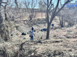 A crew clearing debris and brush from a construction site, demonstrating work by HCR, Inc. in Boerne, TX.