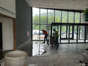 A crew leveling a floor surface in preparation for tile installation by BRB Ceramic Tile & Marble in Metuchen, NJ
