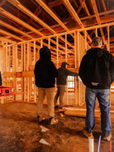 A crew working on the interior framing of a barndominium project by Nashville Barndo Builders in Franklin, TN.