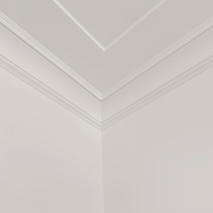 Close-up of crown molding and trim installation in a room corner by Mountain Door and Trim in Phoenix, AZ.