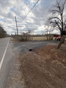 A newly installed culvert and gravel driveway entrance by S&B Construction Services in Shreveport, LA.