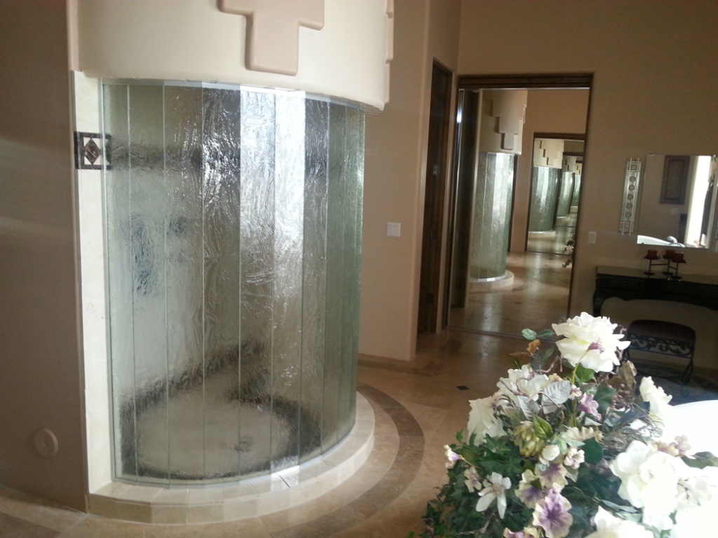 A unique curved glass shower installation completed by Southwest Restoration & Design, Inc. in Peoria, AZ.