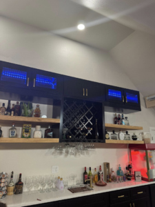 Custom bar cabinetry and shelving installation by Castillo Contracting & Remodeling in Broken Arrow, OK.